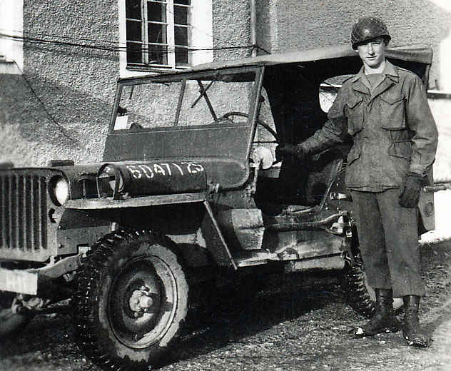 My grandfather next to a jeep in Camp Hallein, Austria.