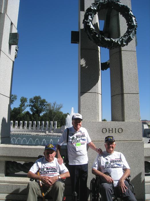 Honor Flight Distinguished WW II Veterans Bob Hickman, Bob Lamp and Bill Taylor pause at their Ohio pillar of the World War II Memorial honoring the service from each of the 50 states and US territories.