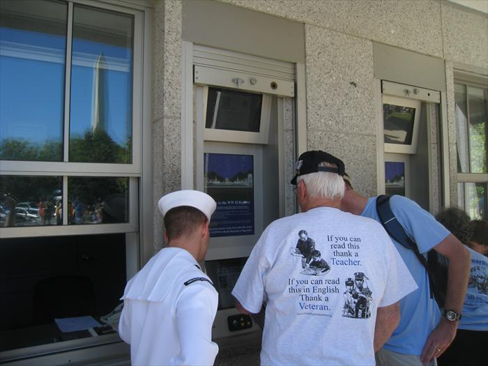 WW II Hero Bob Hickman checks out his own special biography page and photo at the World War II Memorial's Veteran Database on the grounds of the memorial.