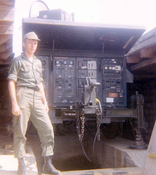 Dennis standing next to a pulse acquisition radar used for tracking incoming enemy aircraftin Korea 1973
