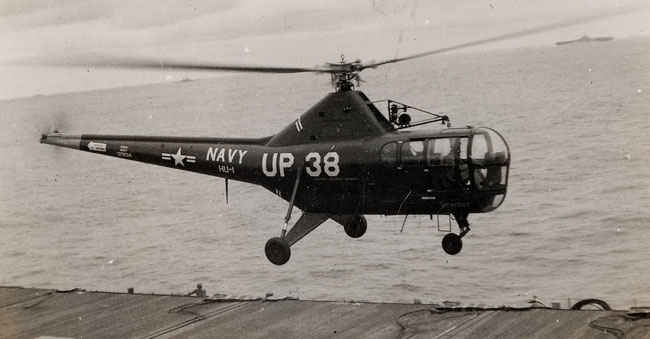 Helicopter flying above USS Boxer Korean War.