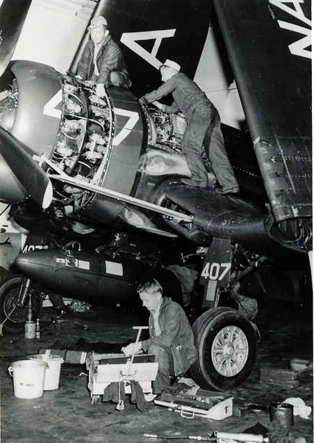 F4U Corsair undergoing maintenance. Each plane would have a plane captain making sure the plan was in flying condition at all times.