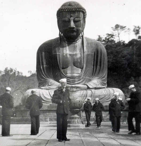 Gene in front of a Buddha during the Korean War in Tokyo.