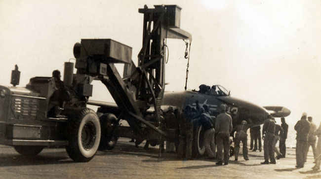 F9F Panther picked up by the tractor loader.