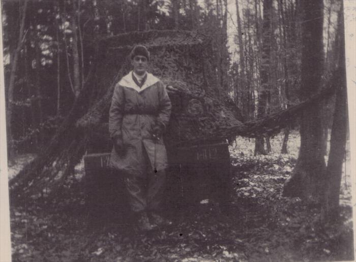 John Tubinis on maneuver in Germany.  Standing in front of a deuce and a half.  1951-1953.