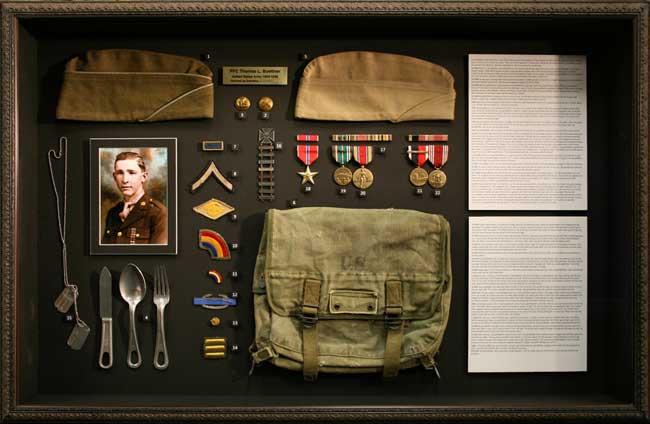 Frame of all Thomas' artifacts from World War II.