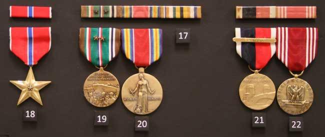 Bronze Star, European-African-Middle Eastern Campaign Medal with Two Battle Stars (Rhineland and Central Europe), World War II Victory Medal  ,Interallied Medal? Not official?,  Army Of Occupation Medal (Germany),  and Good Conduct Medals from World War II.