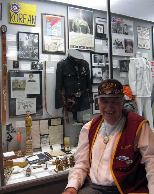 Carl Cossin at the age of 87 sitting in front of his Korean War exhibit at Motts Military Museum, Groveport, Ohio.
