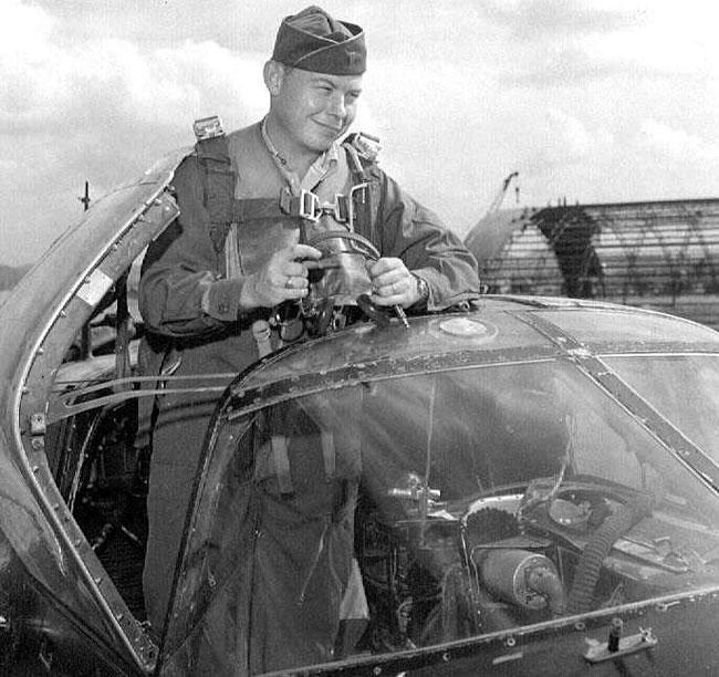 Morris Briggs standing in cockpit of RB-26C at Kimpo Air Base, Korea, 1952.
