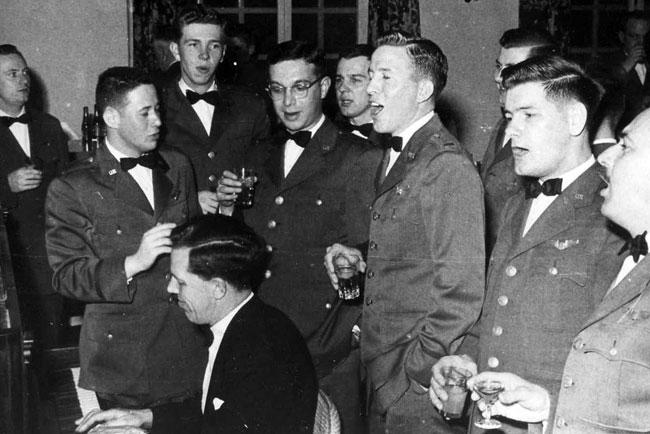 Bringing in the new Year 1957, at Upper Heyford RAF Station, England.  Group singing Auld Lang Syne