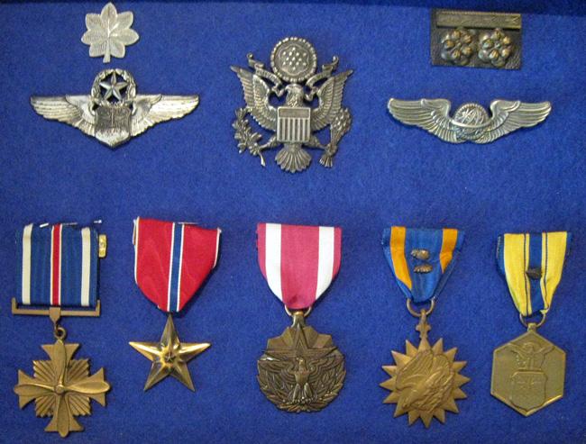 L/R, T/B. Lt Colonel, hat insignia, Lt Colonel Vietnam. Later navigator wings, early navigator wings. Distinguished Flying Cross, Bronze Star, Meritorious Service Medal, Air Medal with two oak leaf clusters, Air Force Accommodation Medal with oak leaf cluster.
