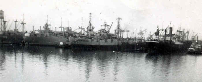 Picture of the Leo in the docks of Sasebo, Japan. The Leo and her sister ships practiced night underway replenishment techniques that helped resolve logistical problems.